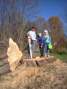Family on tree stump